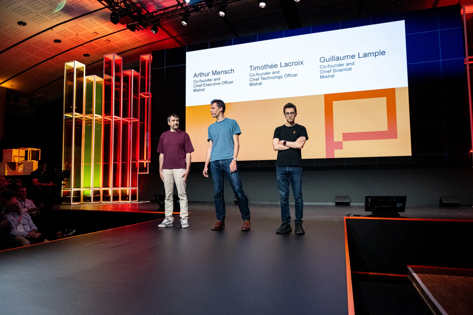 Les fondateurs de Mistral AI sur scène à Paris — Arthur Mensch, Timothée Lacroix, Guillaume Lample